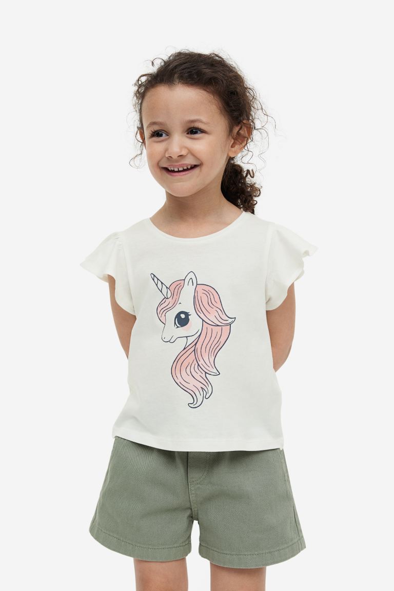 Camisa blanca unicornio h&m niña