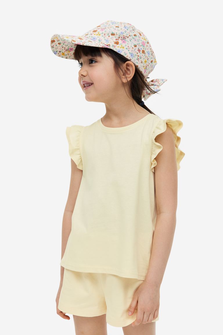 Camisa amarilla revuelos niña H&M