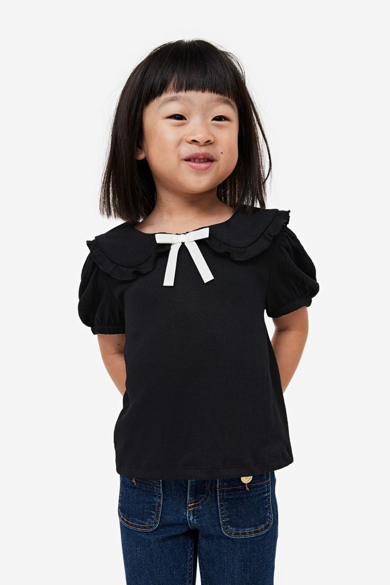 Camisa negra h&m niña coello chongo