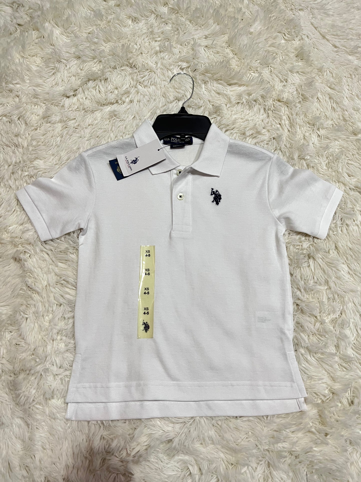 Camisa blanca Polo Nino logo pequeno Kima Shop HN